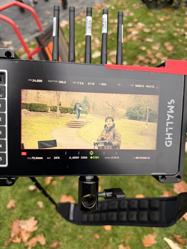 Cruz Paxton on a camera monitor on set